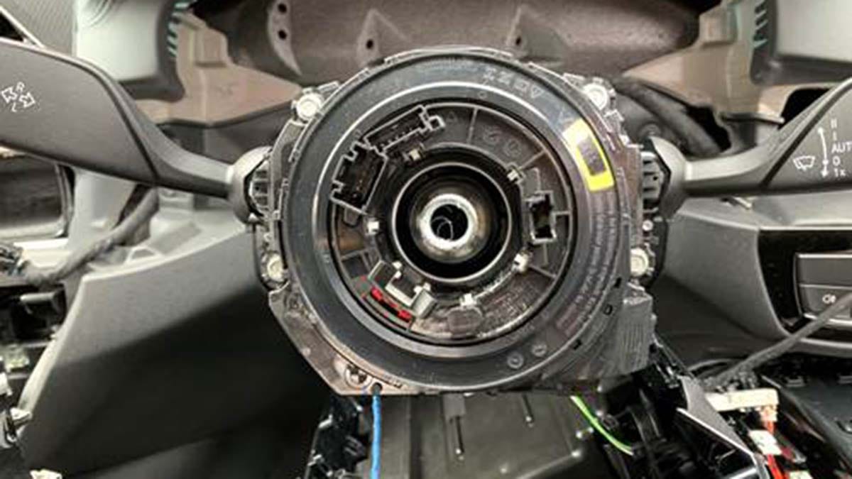 The column where the steering wheel once sat on the BMW