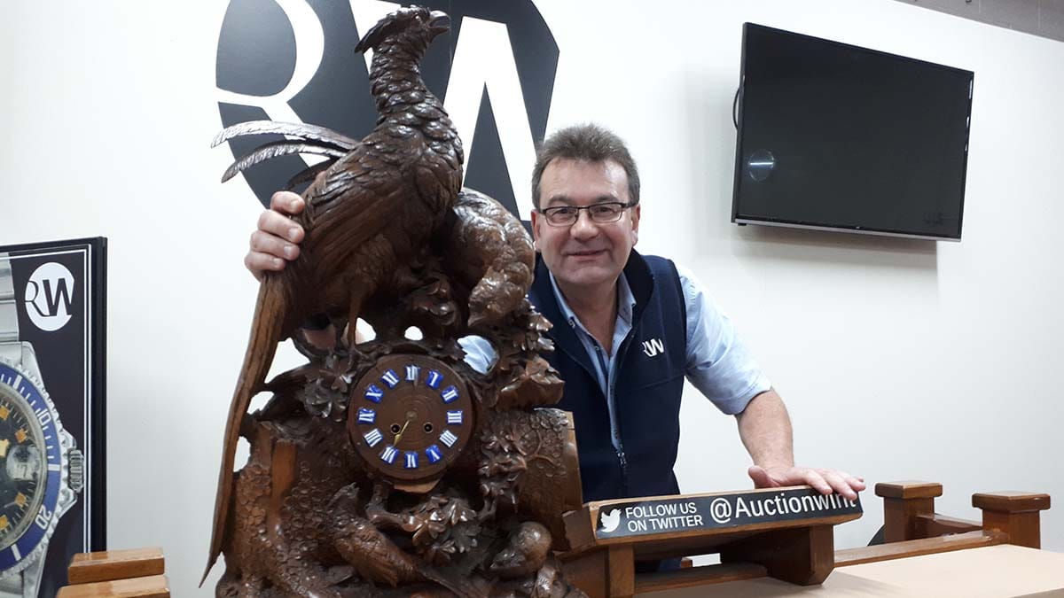 Richard Winterton with one of the clocks