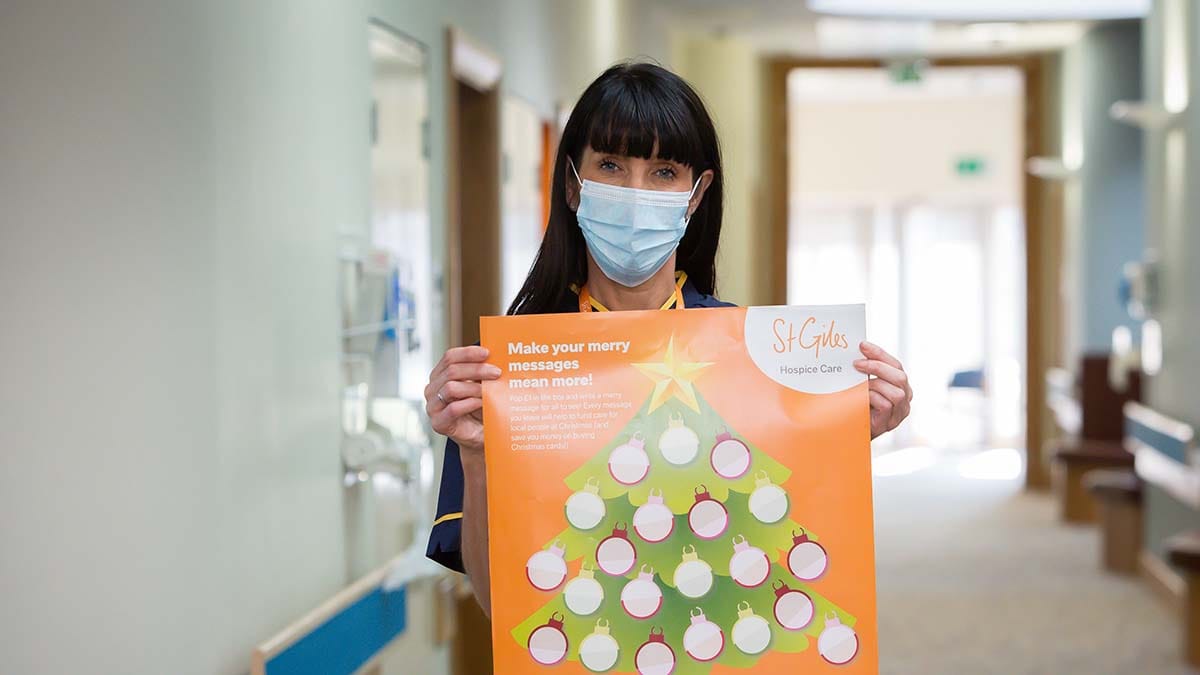 Katie Burbridge with the Merry Messages poster