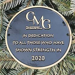 The plaque placed alongside the Christmas tree