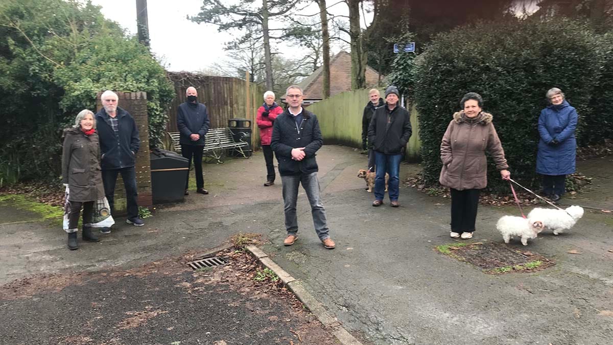 Cllr Paul Ray (centre) with residents at the entrance to the walkway