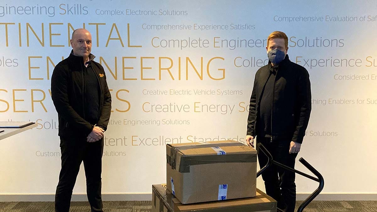 Cllr Doug Pullen (right) receiving the laptops from Continental Engineering Services