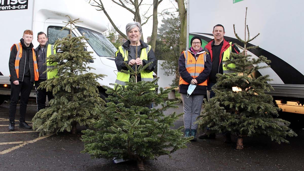 Treecycle volunteers with some of the Christmas trees they collected