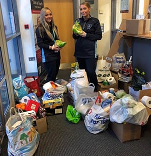 Alisha Vivian and Vikki Wilson with some of the items previously donated to the foodbank