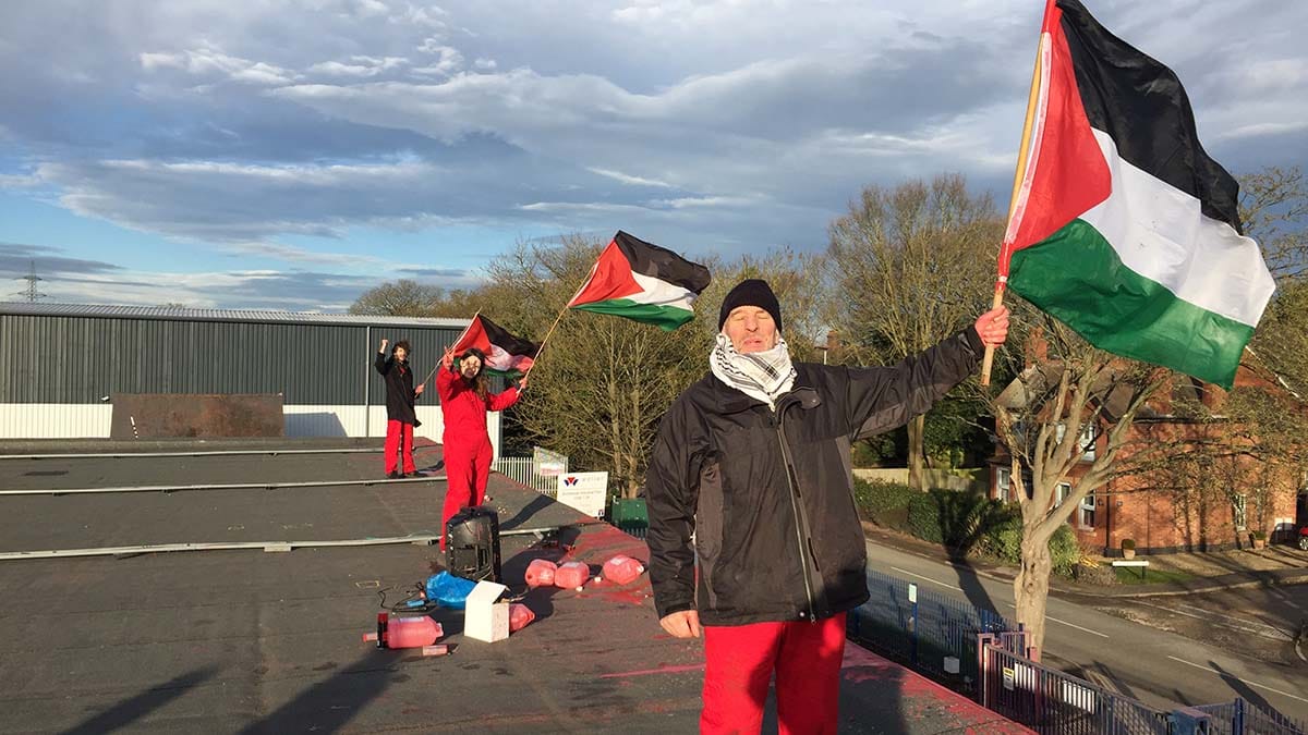Palestine Action members on the roof of the factory in Shenstone. Picture:  Vladimir Morozov