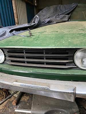 The Triumph Stag when it was found in a barn