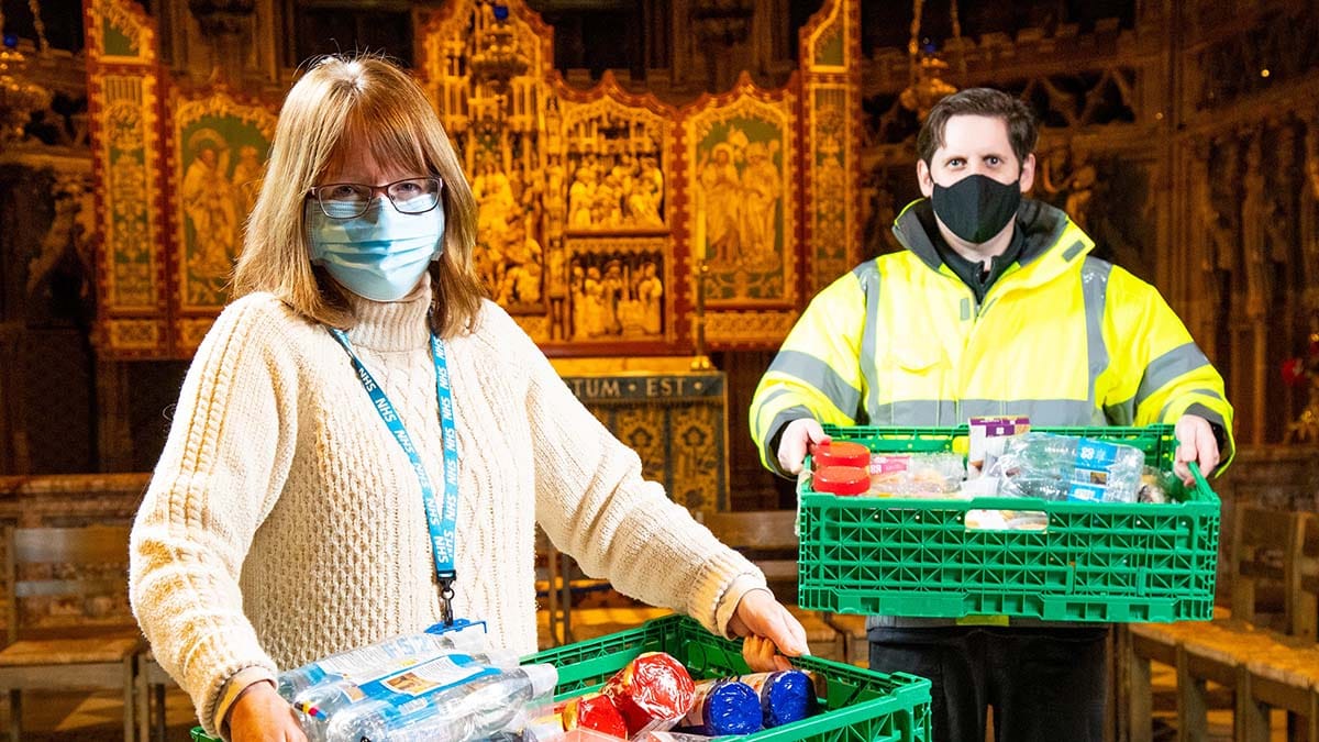 Richard Hinsley hands over the donations to Kirsty Burton at Lichfield Cathedral