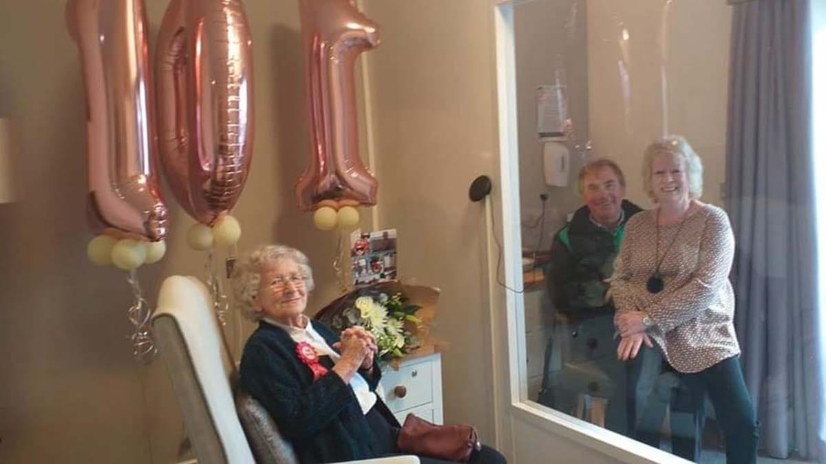 Doreen Robinson being visited by her family