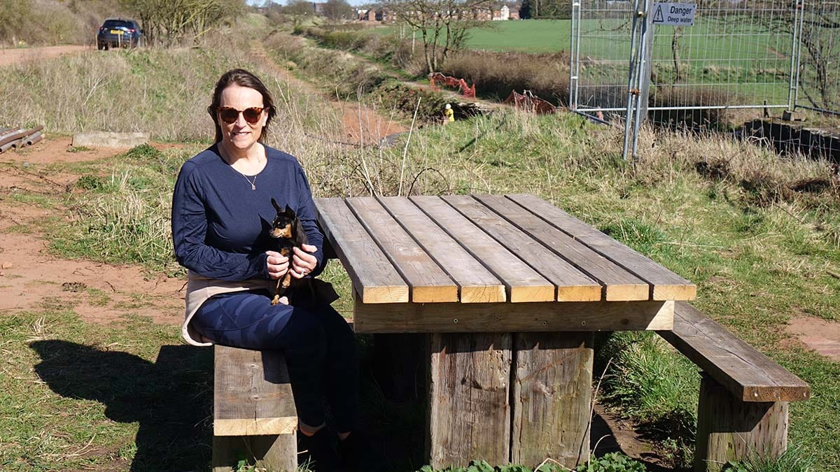 Beth Toovey on the restored bench