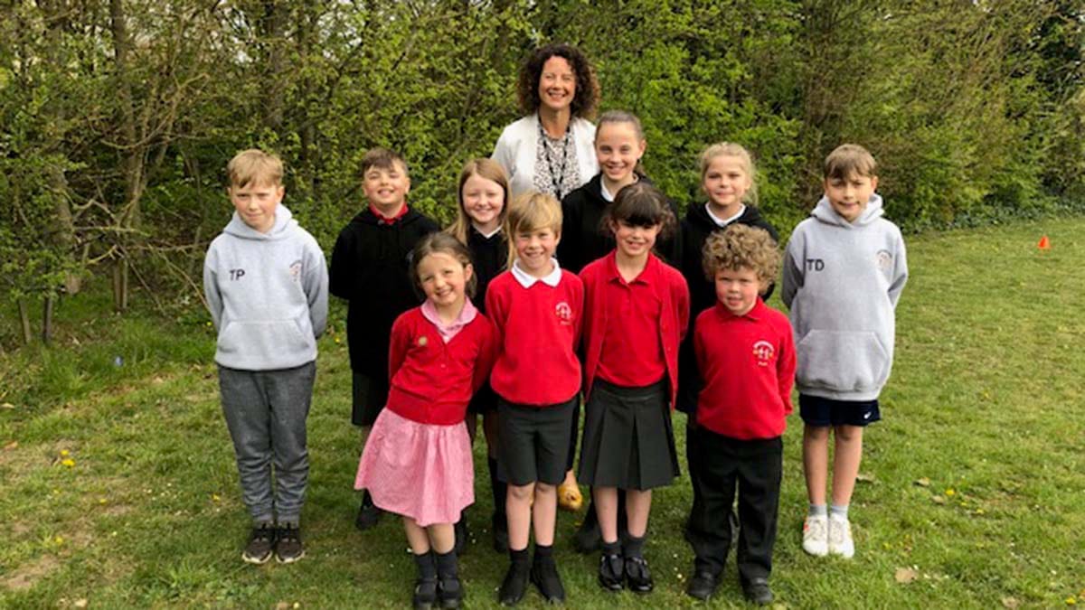Headteacher Ellie Ballinger with pupils from Greysbrooke Primary School