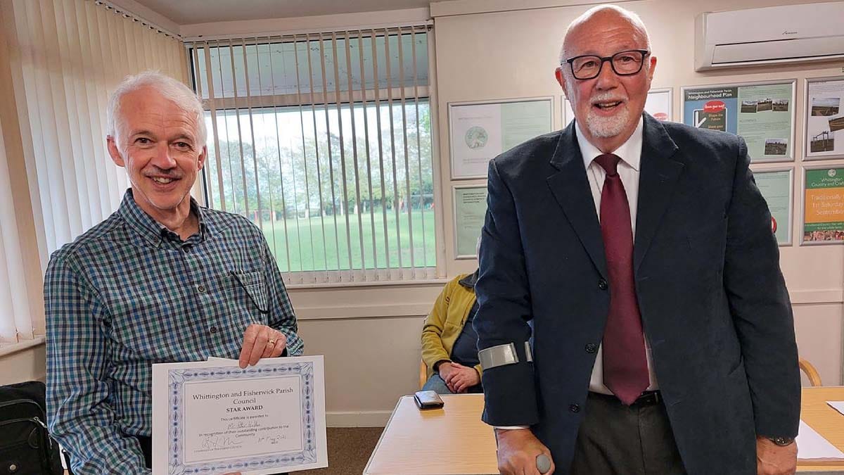 Peter Hollis receiving his award from Cllr Garry Hyde