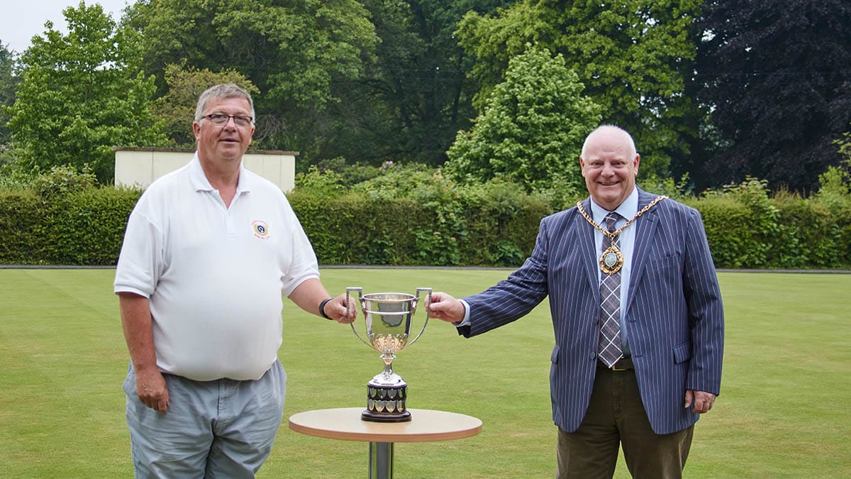 Andy Hayes being presented with the trophy by Cllr Robert Yardley