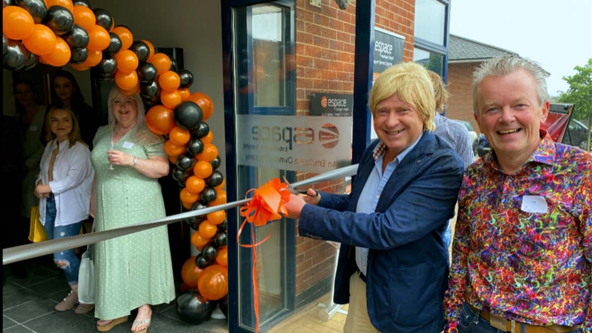 Michael Fabricant cutting the ribbon