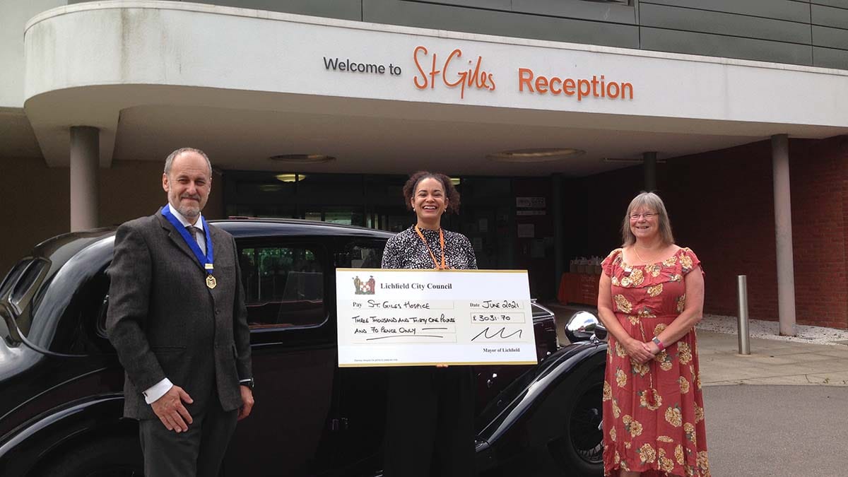 Dr Daryl Brown and Cllr Deborah Baker handing over a cheque at St Giles Hospice