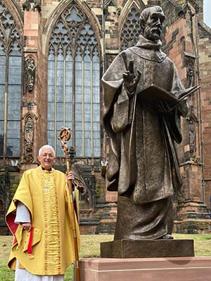 The Rt Revd Dr Michael Ipgrave with the new statue of St Chad