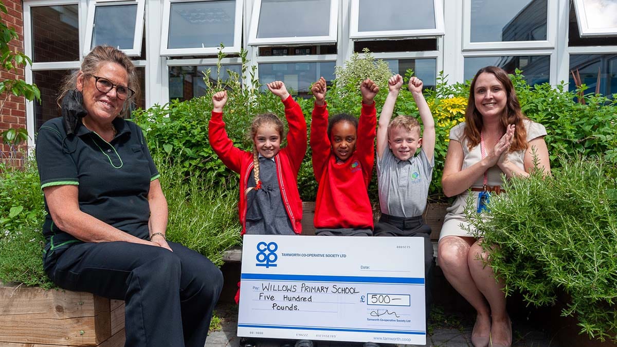 Nicky Gilbert with deputy headteacher Laura Lazenby and some of the pupils in the herb section of the school’s garden