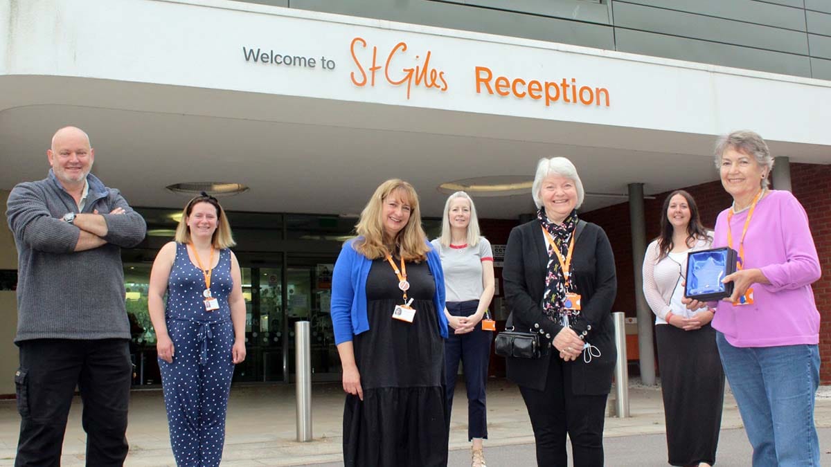 Some of the volunteers and staff at St Giles Hospice celebrating their award