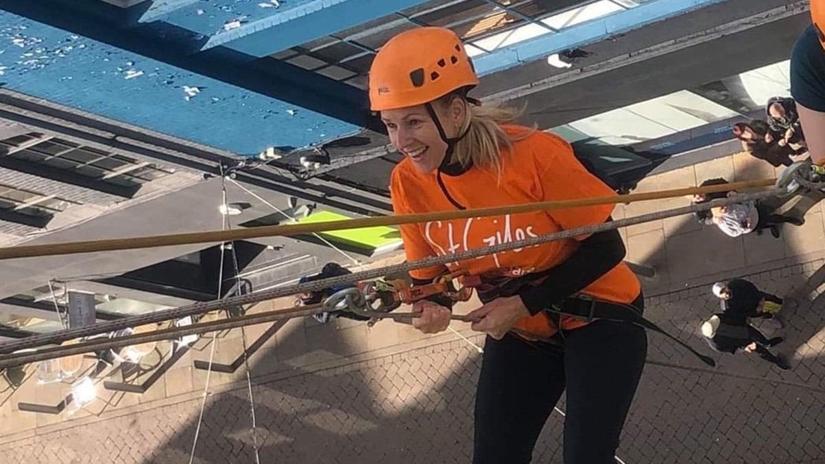 Claire Barton taking on the St Giles Hospice abseil challenge in 2019