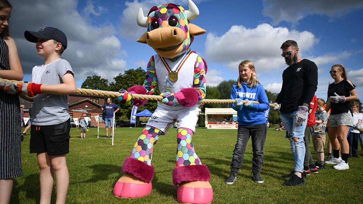 Perry the Commonwealth Games mascot taking part in tug of war