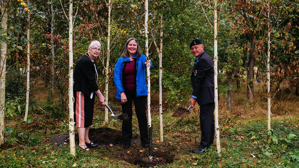The final tree being planted by Una Cleminson, Jacqui Thompson and Terry Barnett