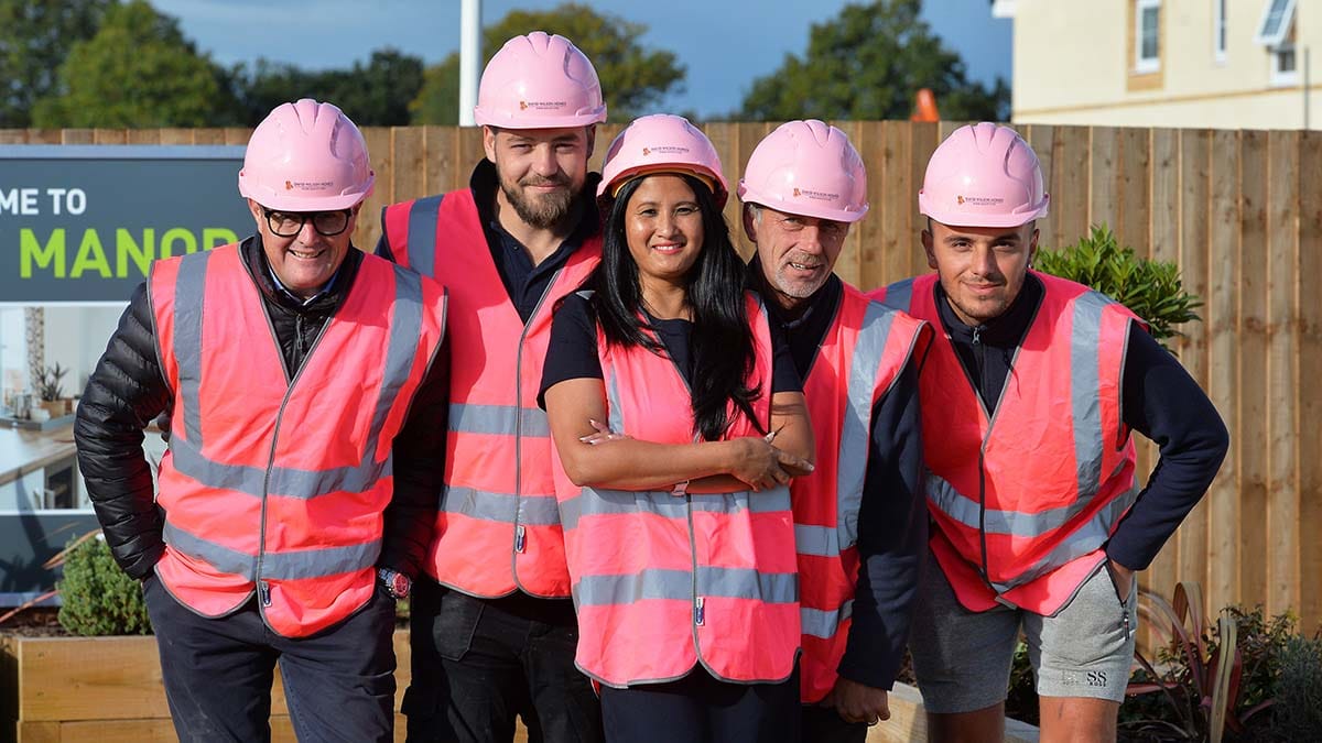Staff at the Fradley development in their pink outfits