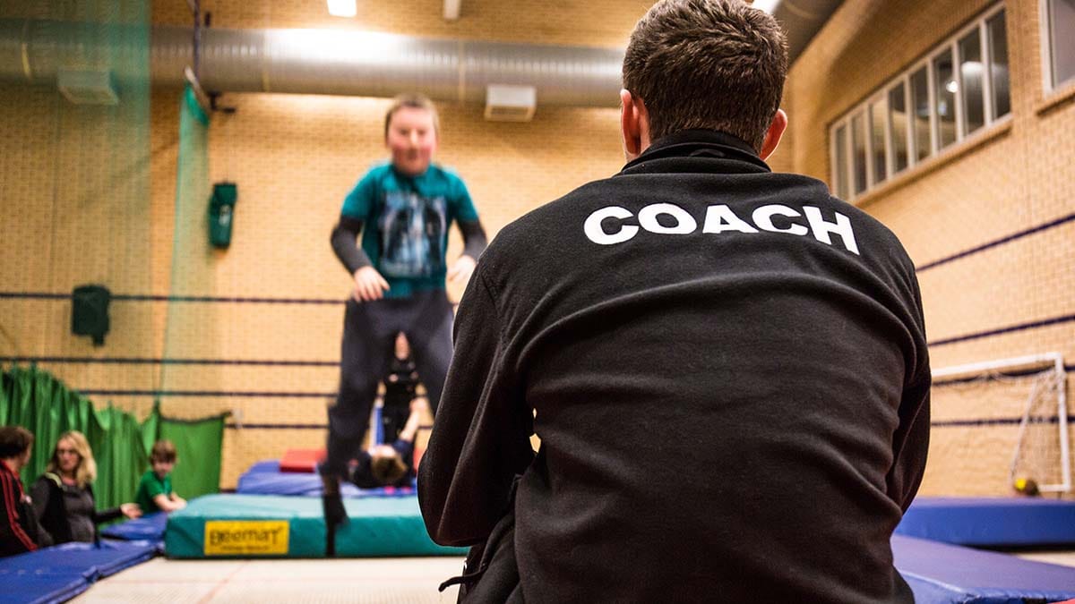 Sports coach supervising a session