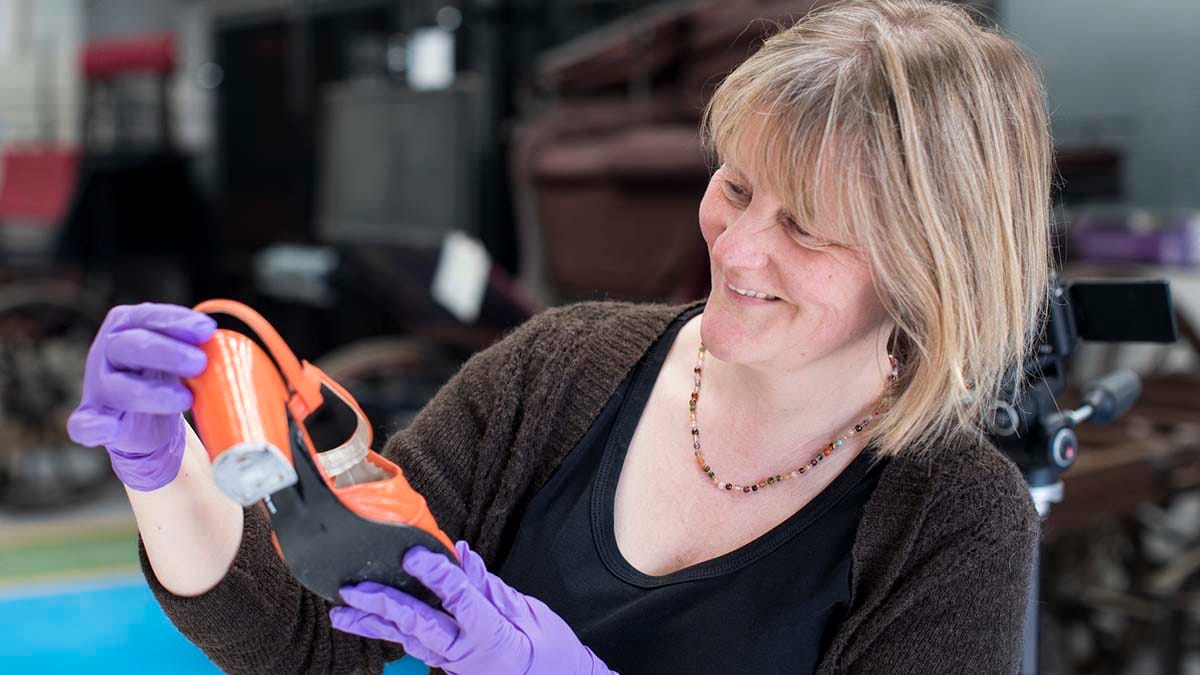 Helen Johnson from the archives and heritage service with a shoe donated by a Stonnall resident