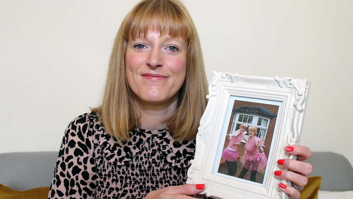 Rebecca Horton-Worby with a picture of herself and her mother