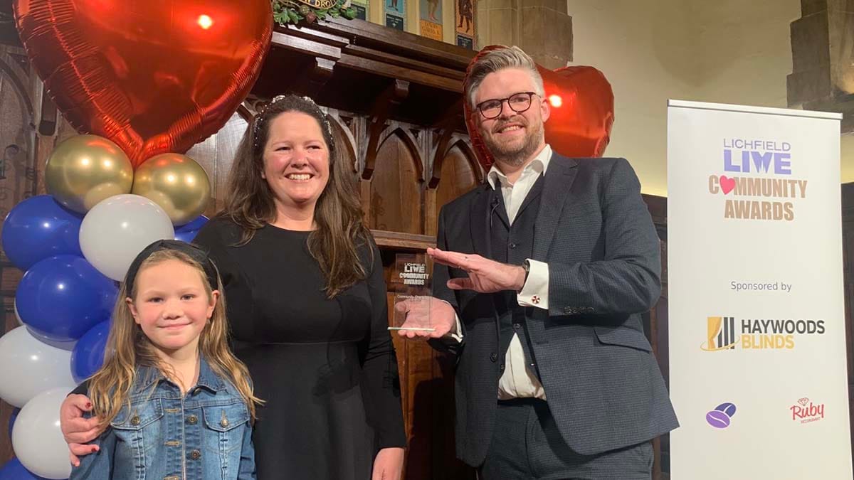Community Champion Esther Allen receiving her award from Chris Purchase