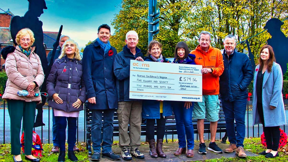 The cheque being handed over to Acorns Hospice