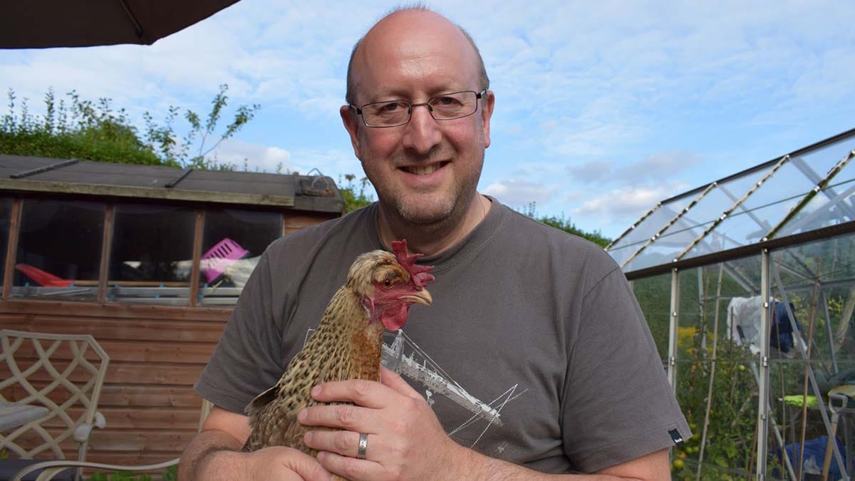Robert Clayton with one of his chickens