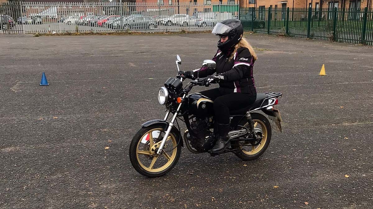 Sheila McMahon learning to ride a motorbike