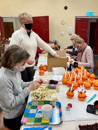 Volunteers making Christingles. Picture: Lichfield Cathedral