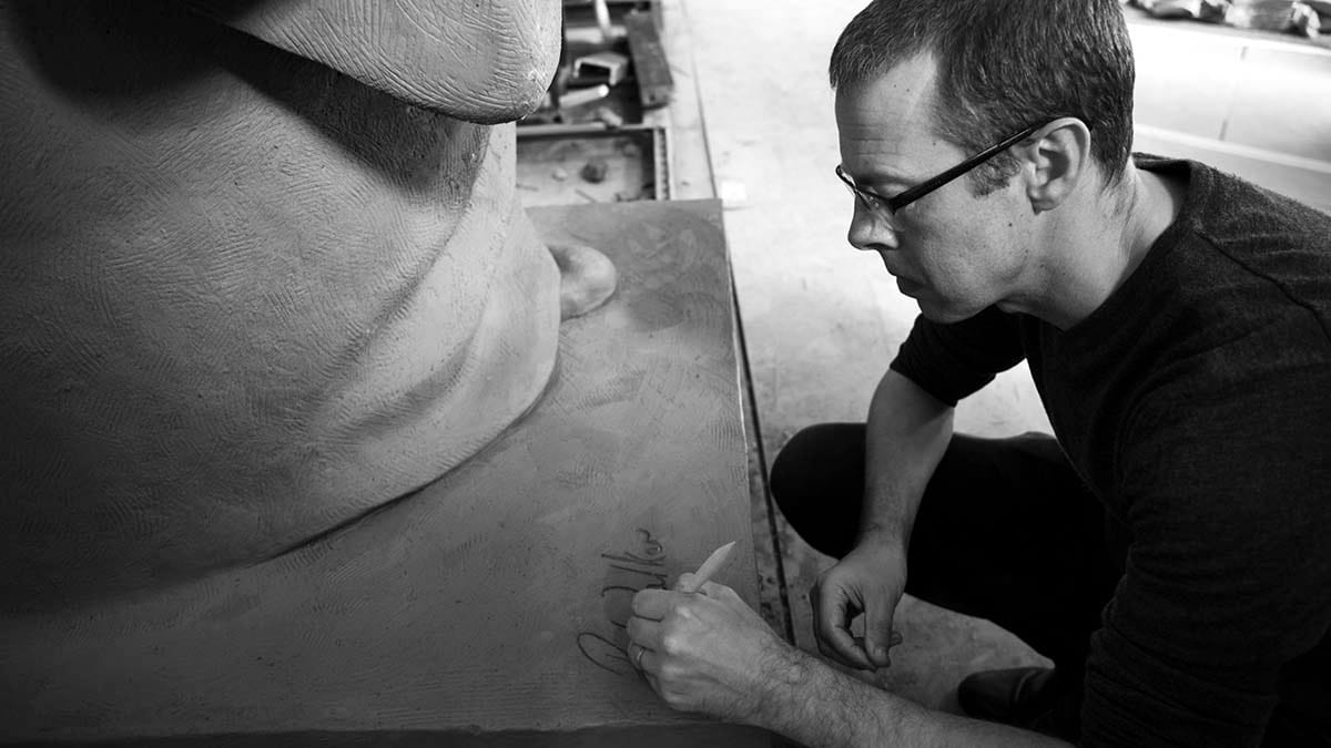 Peter Walker signing one of his works