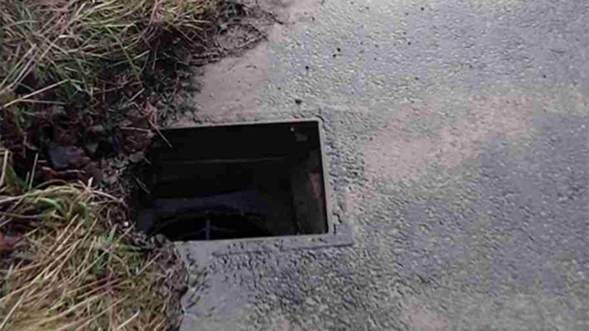 A roadside drain missing its cover