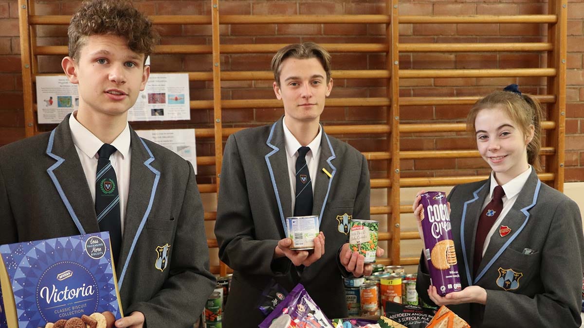 Jacob Blakemore, Tom Walton and Cody Moore with some of the items collected for Lichfield Foodbank