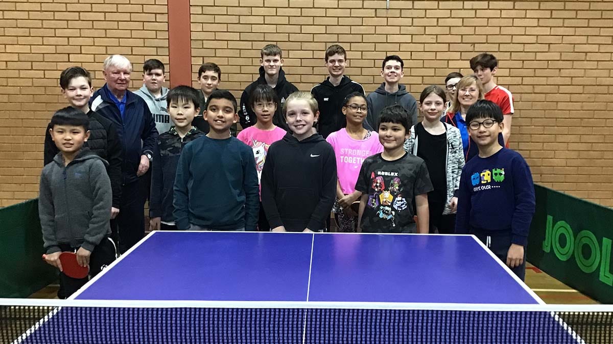 Players at a table tennis coaching session