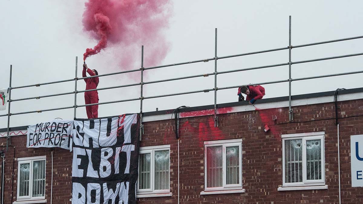 Protesters on the roof at the UAV Engines site in Shenstone. Picture: Guy Smallman