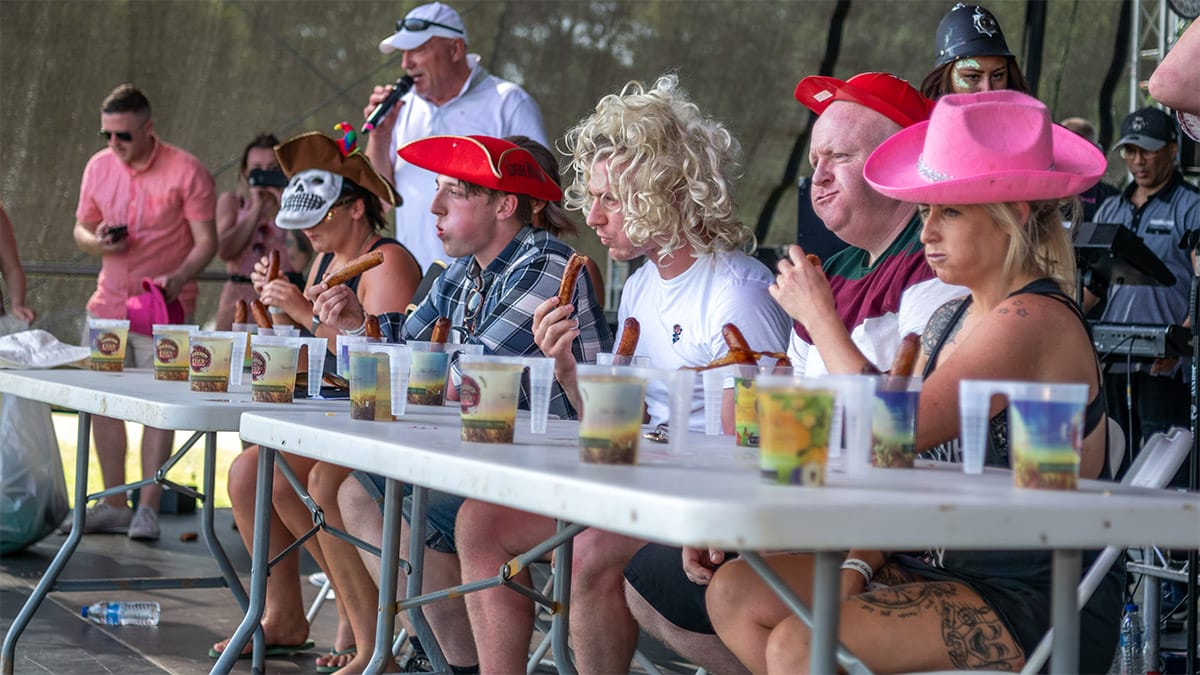 An eating competition at the Sausage and Cider Festival