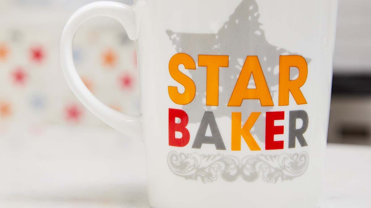 A fundraising Stand Up To Cancer mug