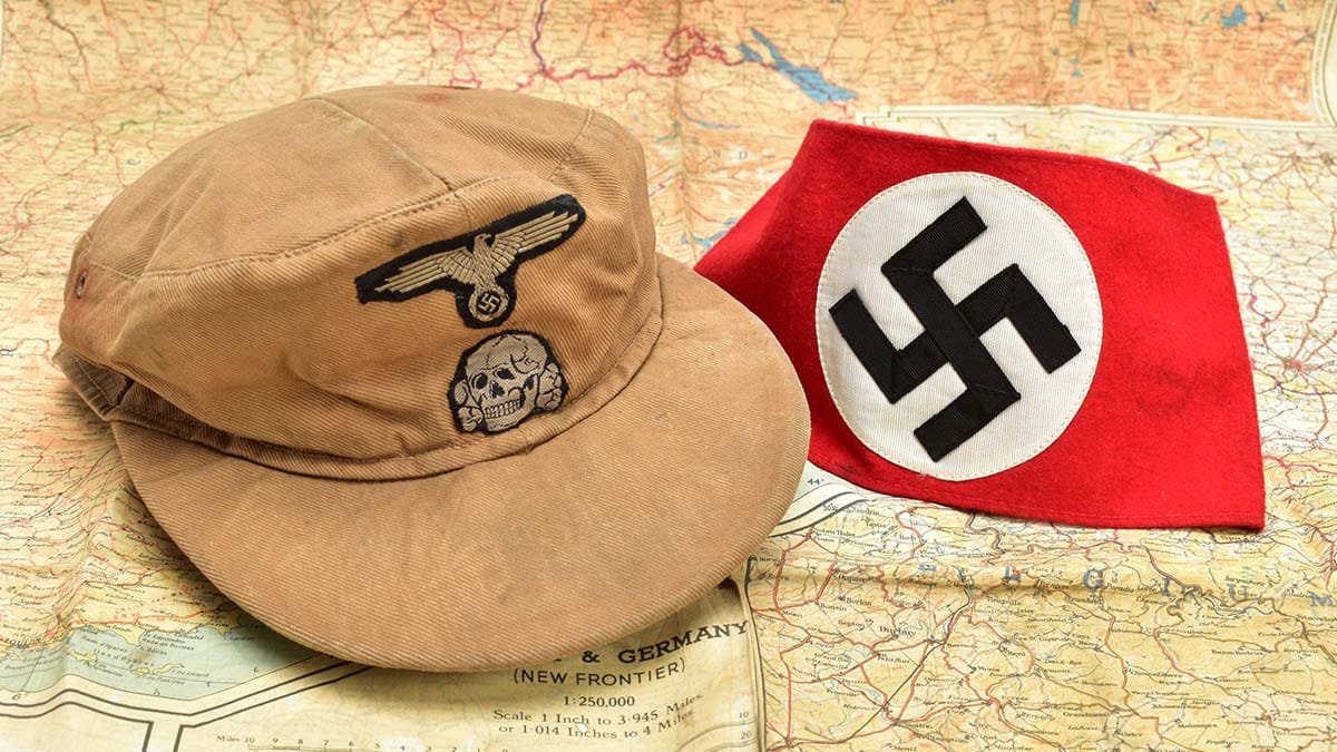 An SS cap and Nazi armband that are being sold at auction in Lichfield