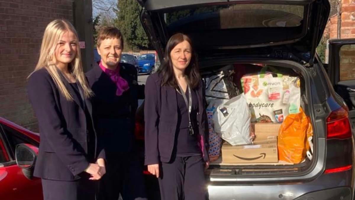 Millie Vaughan, Sharon Bratt and Helena Williams from Specsavers loading up some of the donations