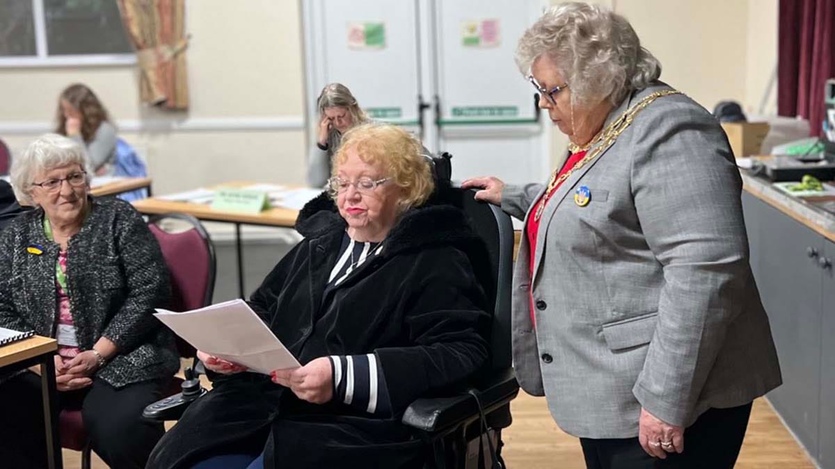 Kathy Coe MBE (centre) at the meeting of Burntwood Town Council