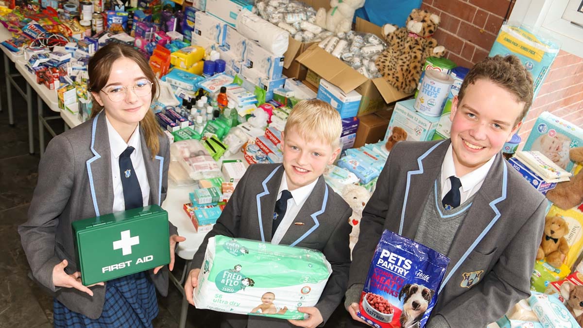 Heidi Fletcher, Finley Bisseker and Aiden Treadwell with some of the donated items
