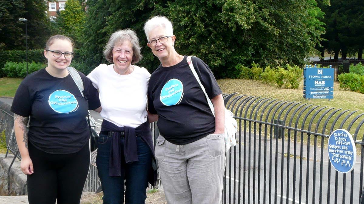 Members of the Lichfield Wayward Women group with one of their plaques