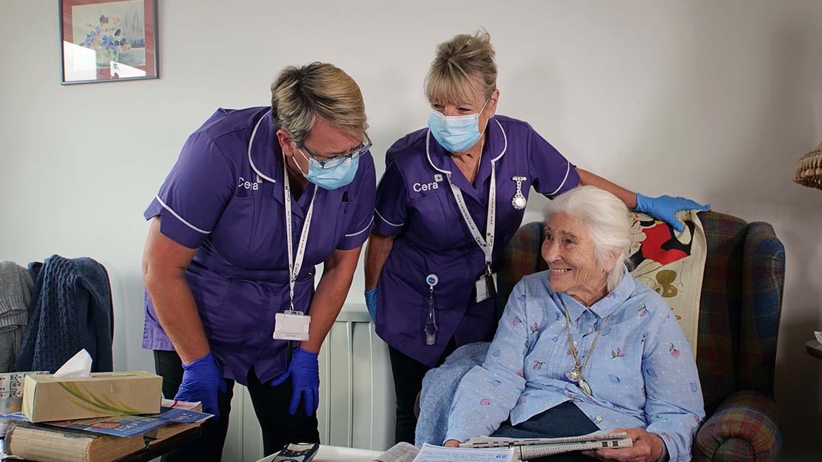 Cera staff helping a resident