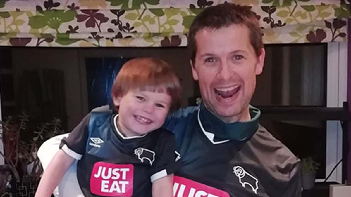 Chris Carey with one of his children