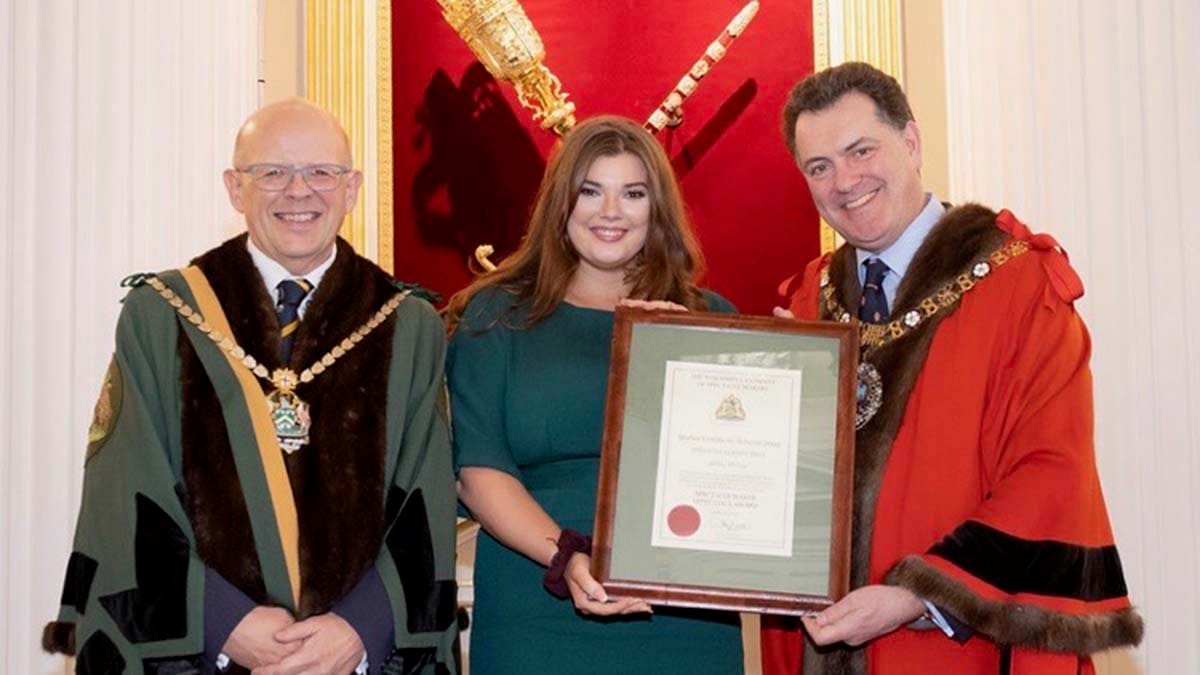 Abbie Hulme with Ian Davies and Vincent Keaveny at the ceremony