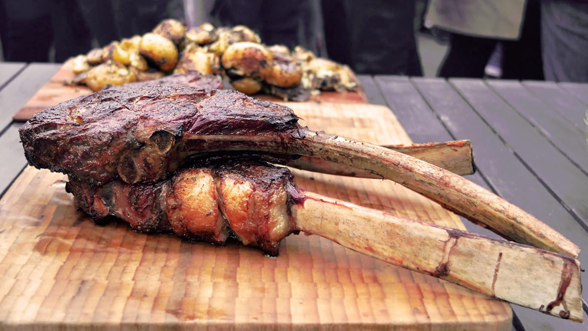 A tomahawk steak cooked on the barbecue