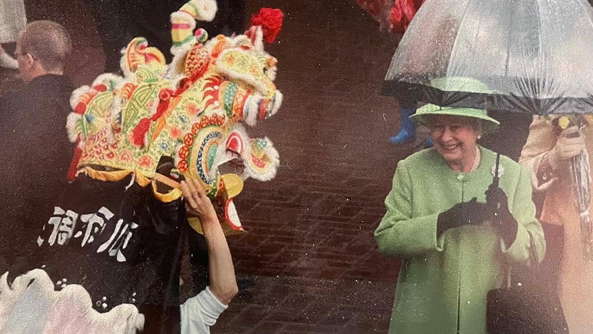 The Queen being entertained by a traditional Chinese dance in 2002